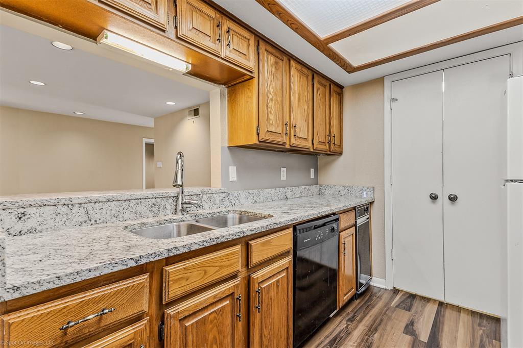 925 Signal Ridge Place Rockwall, TX 75032 - Photo 4 of 21 a bathroom with a granite countertop sink and a mirror