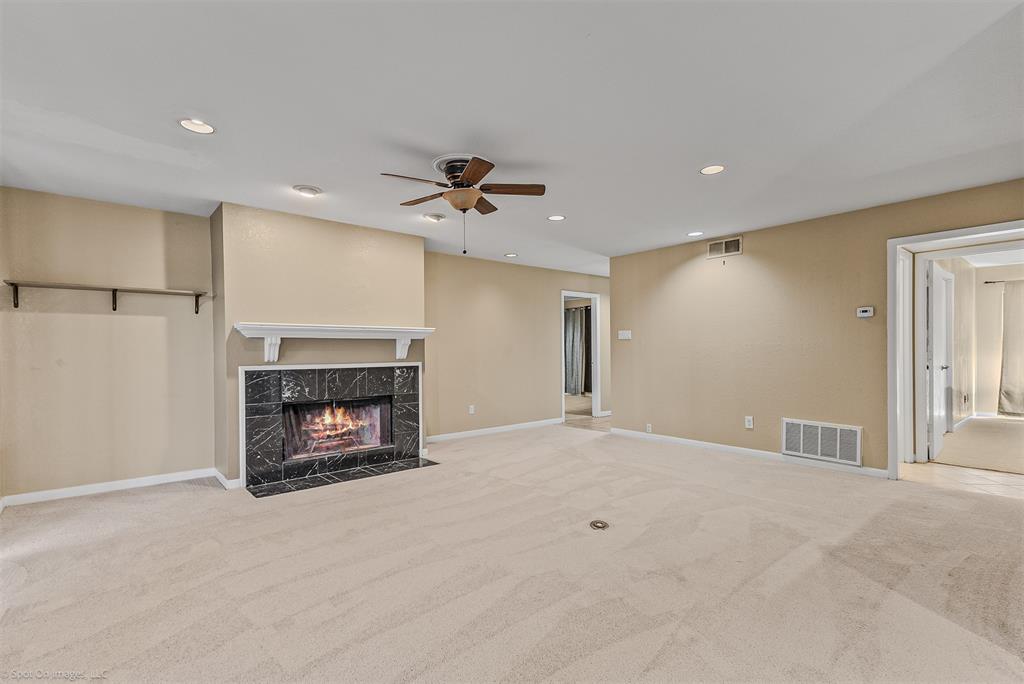 925 Signal Ridge Place Rockwall, TX 75032 - Photo 6 of 21 a view of an empty room with a fireplace