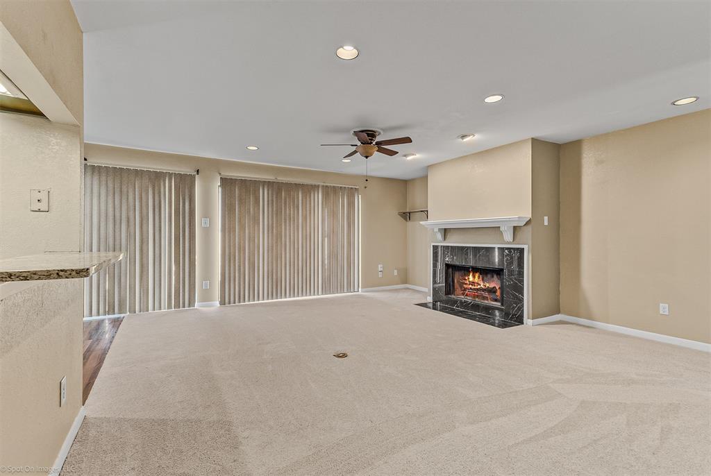 925 Signal Ridge Place Rockwall, TX 75032 - Photo 7 of 21 a view of an empty room with a fireplace