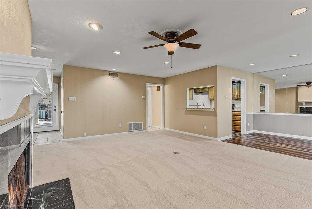 925 Signal Ridge Place Rockwall, TX 75032 - Photo 8 of 21 a view of a livingroom with a fireplace