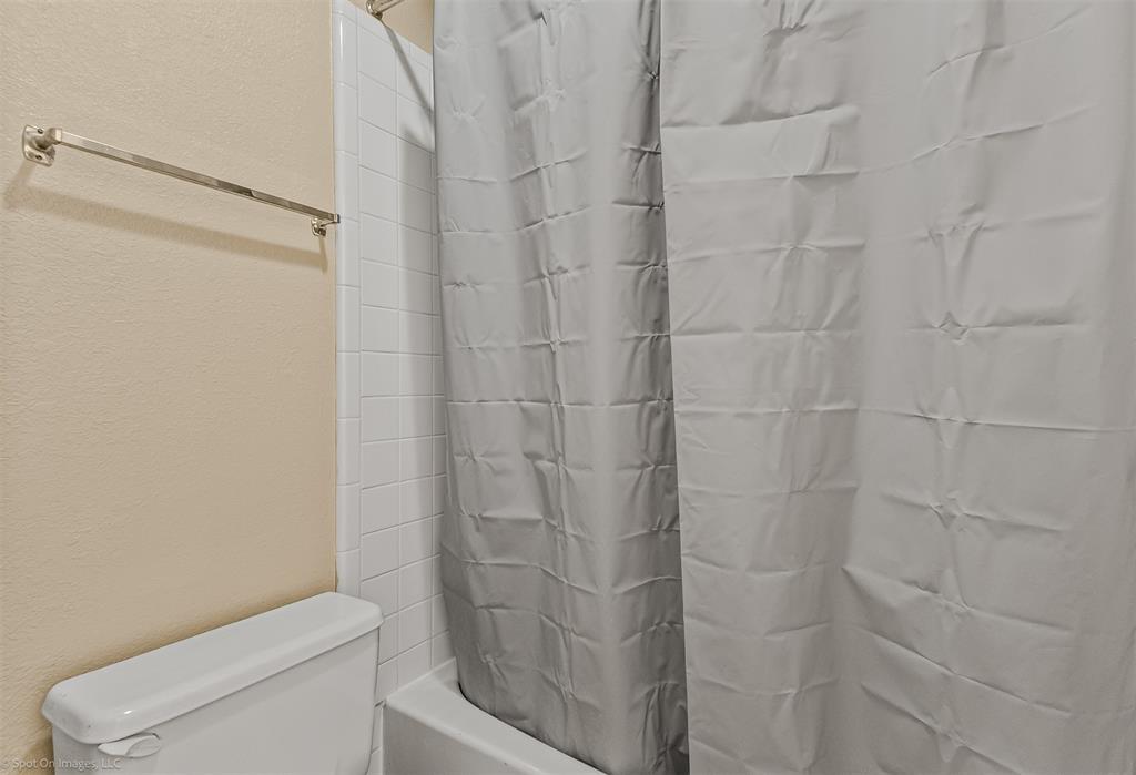 925 Signal Ridge Place Rockwall, TX 75032 - Photo 10 of 21 a bathroom with a shower and toilet