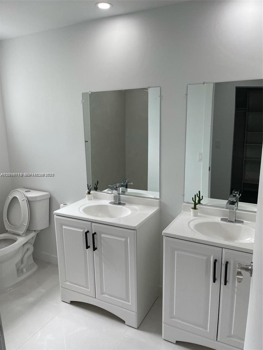 12328 Southwest 259th Street Homestead, FL 33032 - Photo 13 of 18 a bathroom with a sink and a toilet