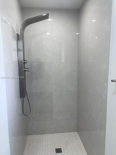 12328 Southwest 259th Street Homestead, FL 33032 - Photo 14 of 18 a bathroom with a glass shower door