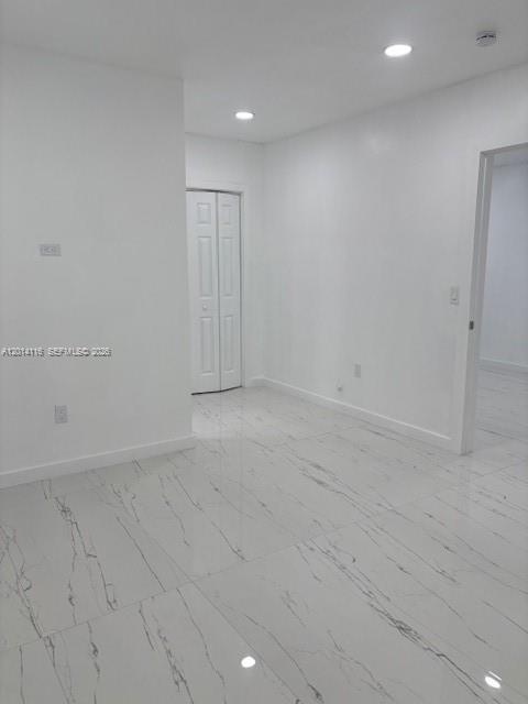 12328 Southwest 259th Street Homestead, FL 33032 - Photo 6 of 18 an empty room with an entryway