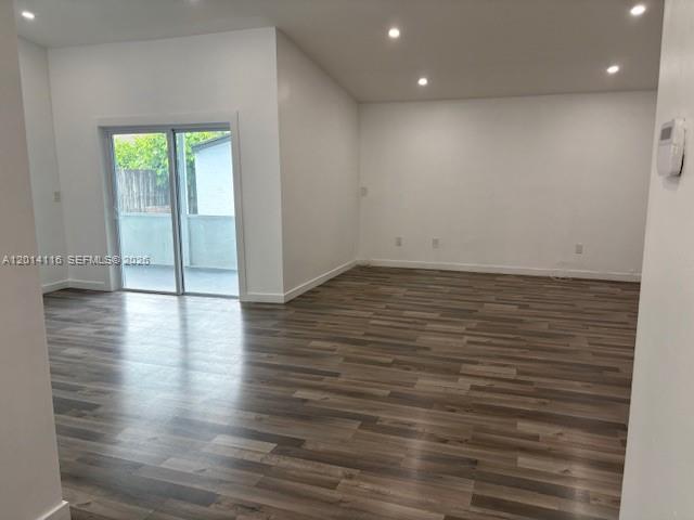 12328 Southwest 259th Street Homestead, FL 33032 - Photo 8 of 18 an empty room with wooden floor and windows