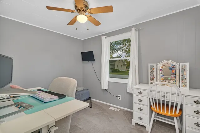 a bedroom with furniture and a window