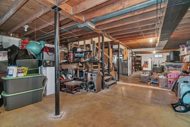a view of a storage room with a refrigerator