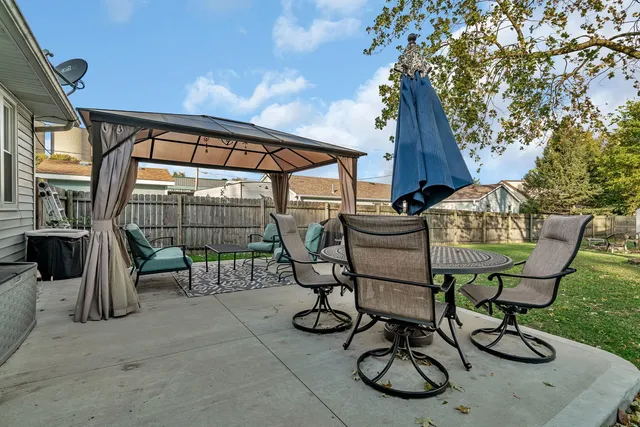 a view of an outdoor sitting area with furniture and wooden deck