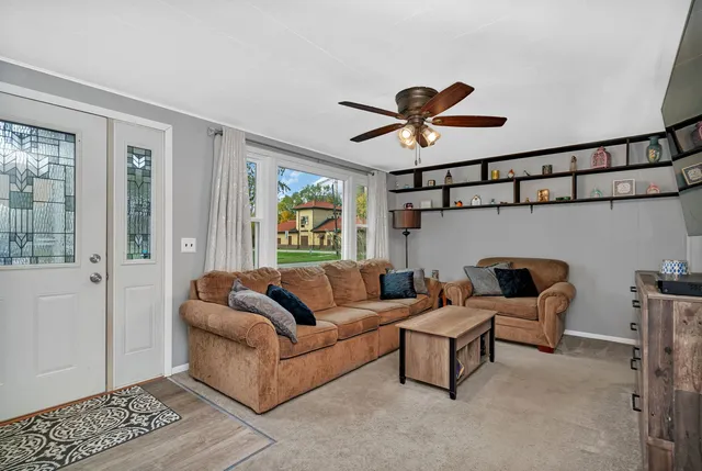 a living room with furniture and a window