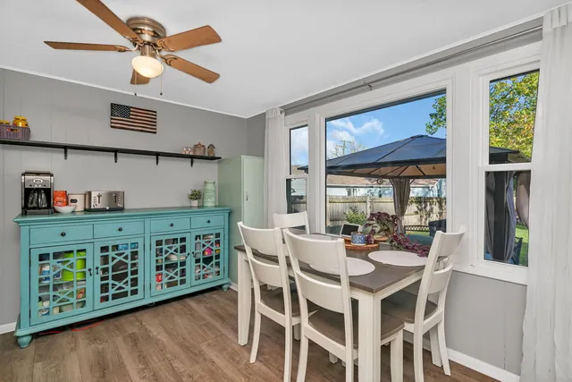 a dining room with furniture and window