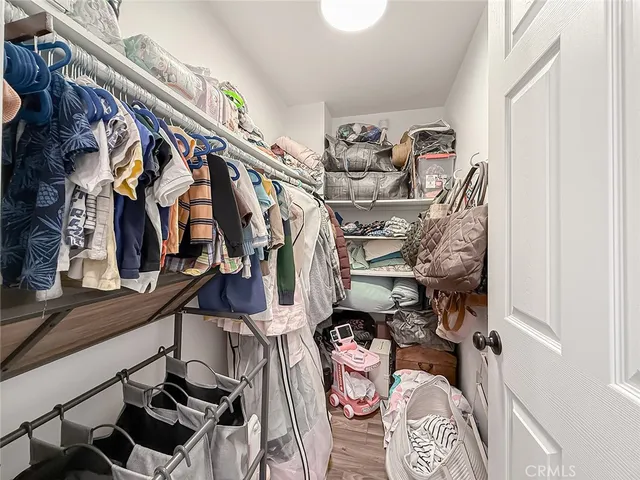 a bedroom with a bed and a fireplace