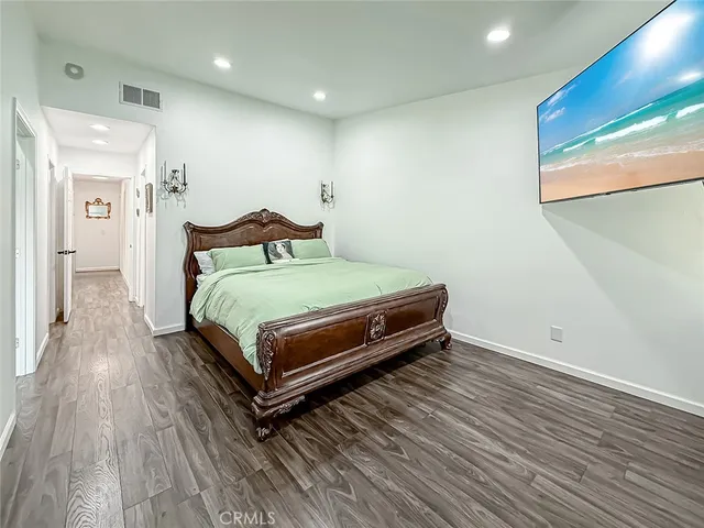 a bed room with a bed and a chair