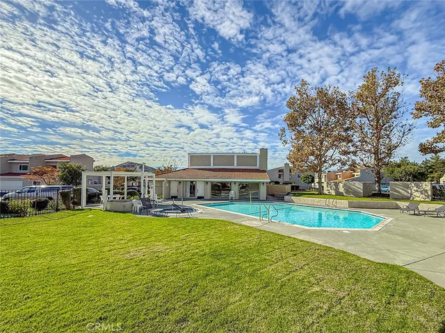 a view of a swimming pool with a patio