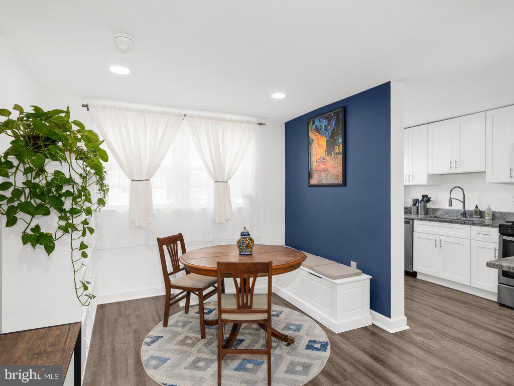 1402 Barrett Road Gwynn Oak, MD 21207 - Photo 4 of 31 a view of a dining room with furniture and wooden floor