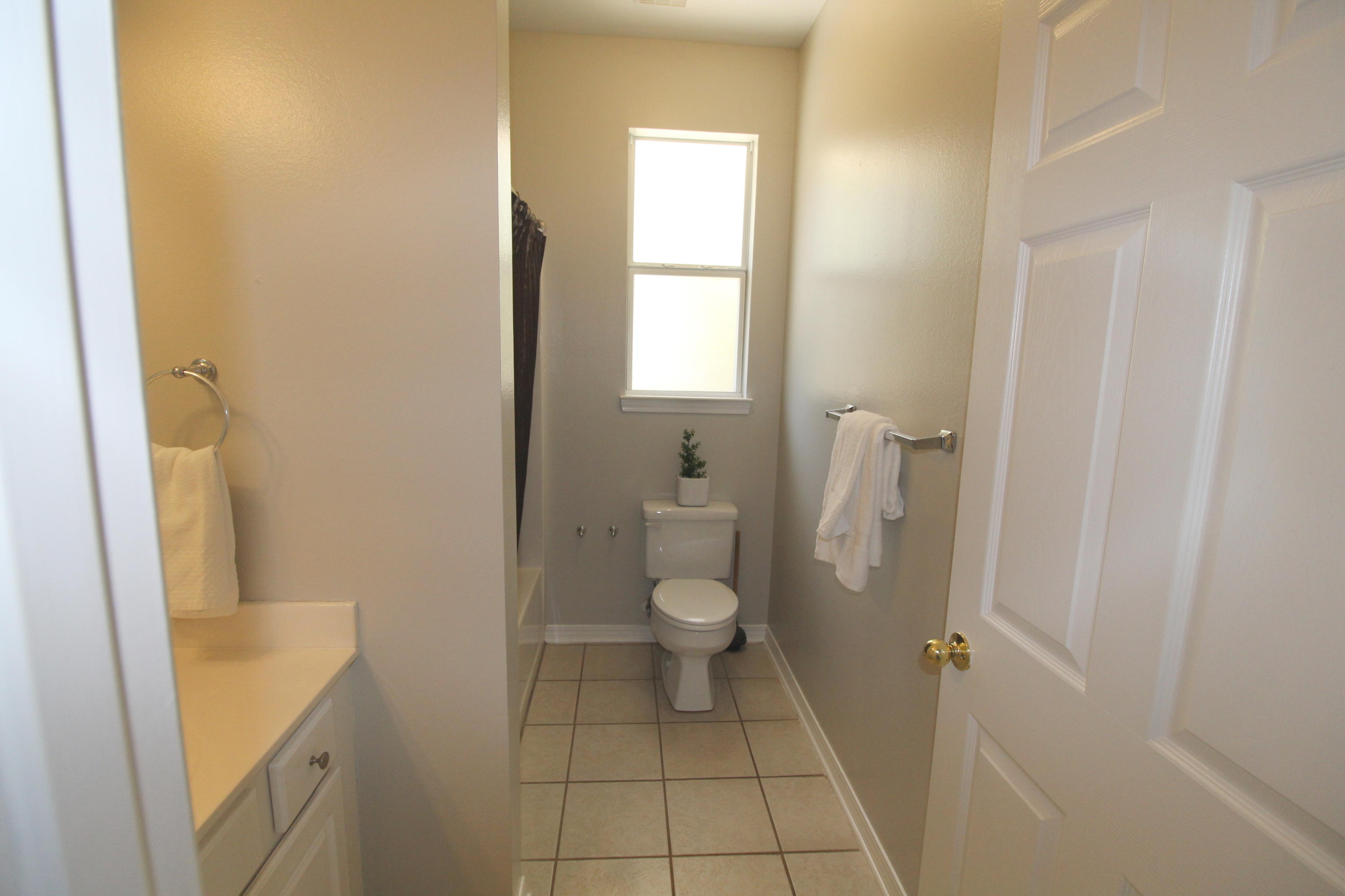 91 Walnut Street Santa Rosa Beach, FL 32459 - Photo 24 of 39 a bathroom with a granite countertop toilet and a sink
