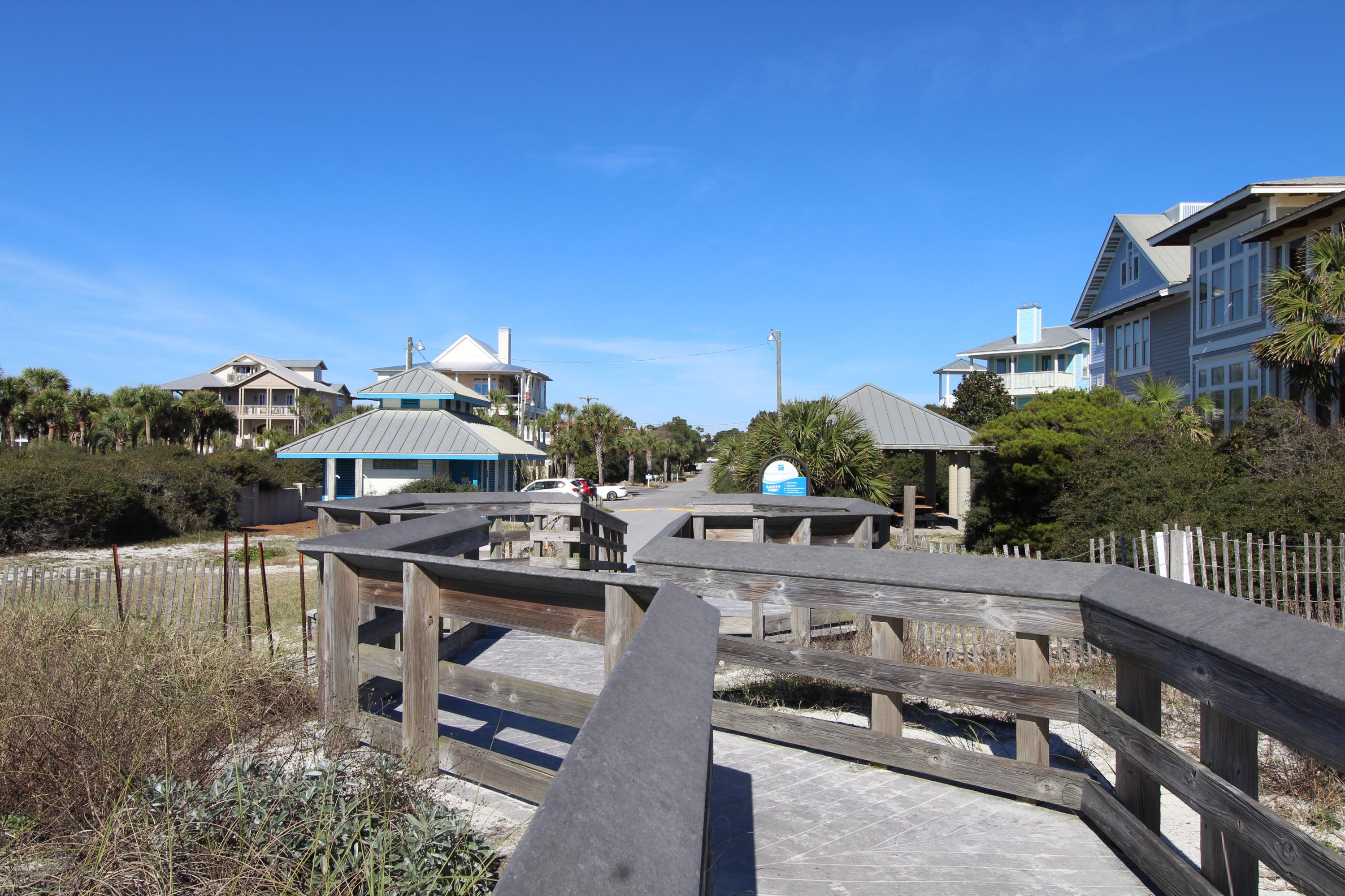 91 Walnut Street Santa Rosa Beach, FL 32459 - Photo 28 of 39 a view of a patio with table and chairs a barbeque