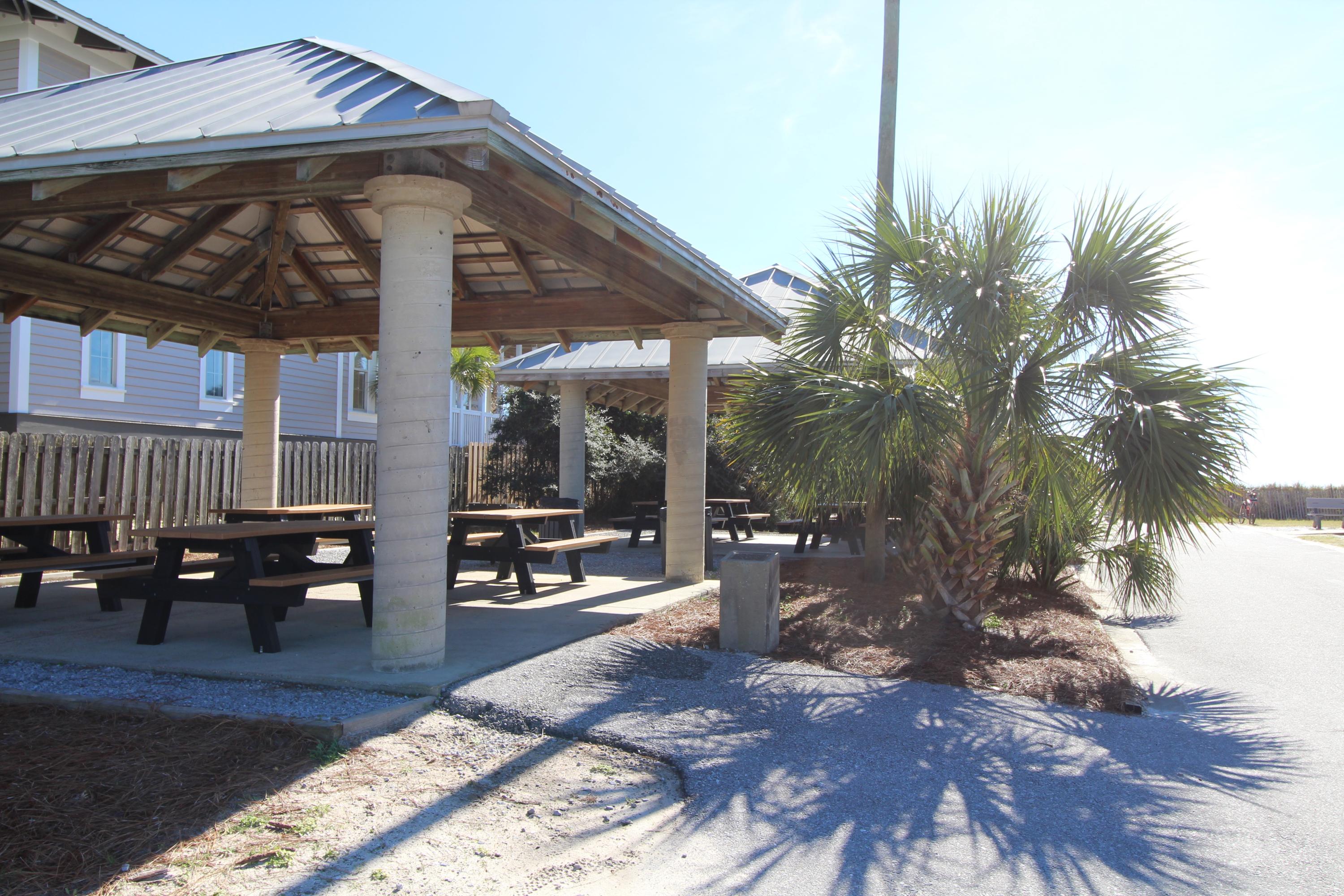 91 Walnut Street Santa Rosa Beach, FL 32459 - Photo 34 of 39 a view of a chairs and table in the patio