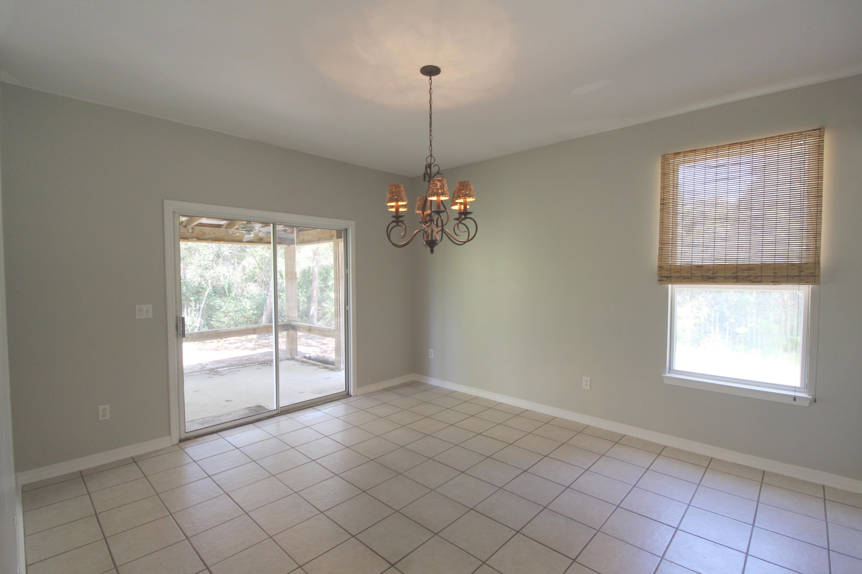 91 Walnut Street Santa Rosa Beach, FL 32459 - Photo 9 of 39 a view of a room with window chandelier fan