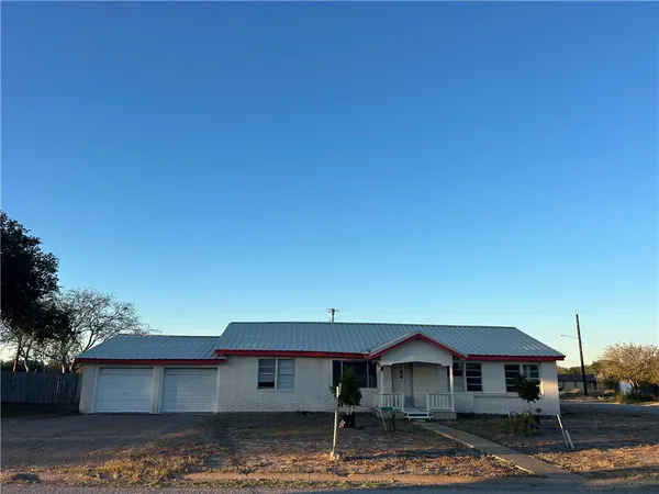 a front view of a house with yard
