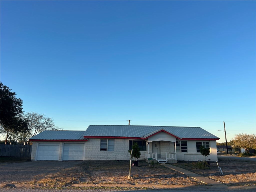 a front view of a house with yard