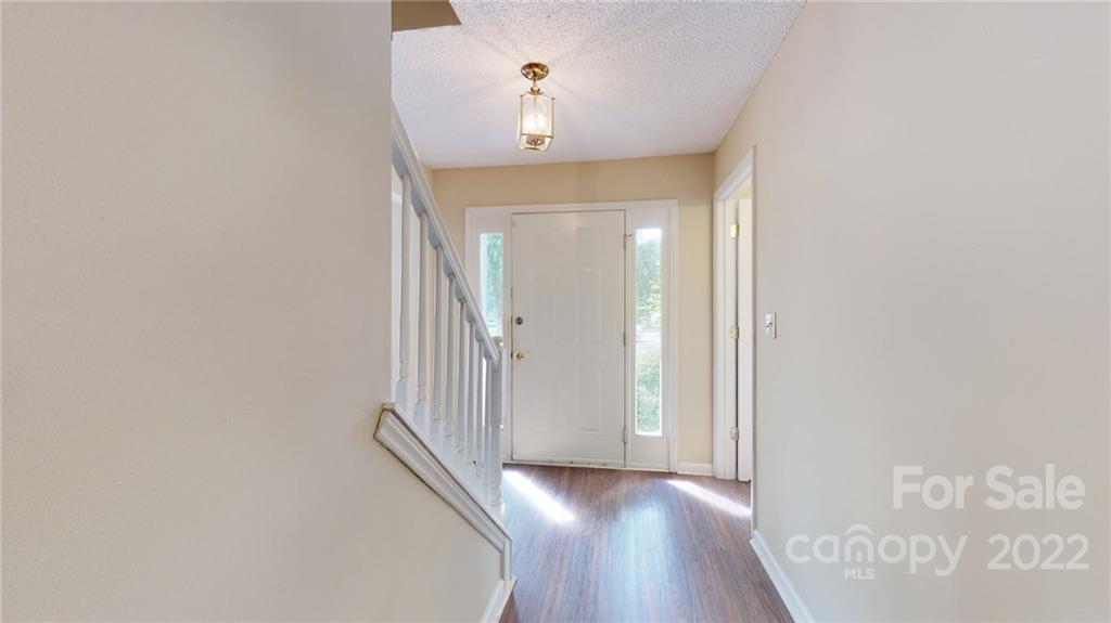 6401 Mounting Rock Road Charlotte, NC 28217 - Photo 2 of 35 a view of a hallway with wooden floor