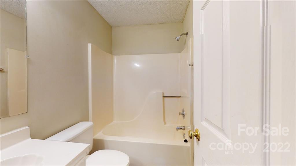 6401 Mounting Rock Road Charlotte, NC 28217 - Photo 23 of 35 a bathroom with a shower and a toilet