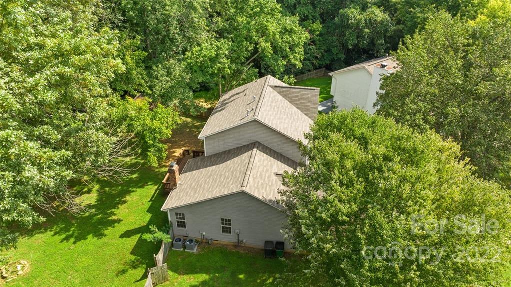 6401 Mounting Rock Road Charlotte, NC 28217 - Photo 32 of 35 an aerial view of a house with yard and trees in the background