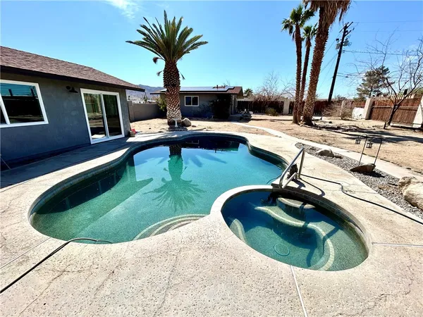 a swimming pool with outdoor seating