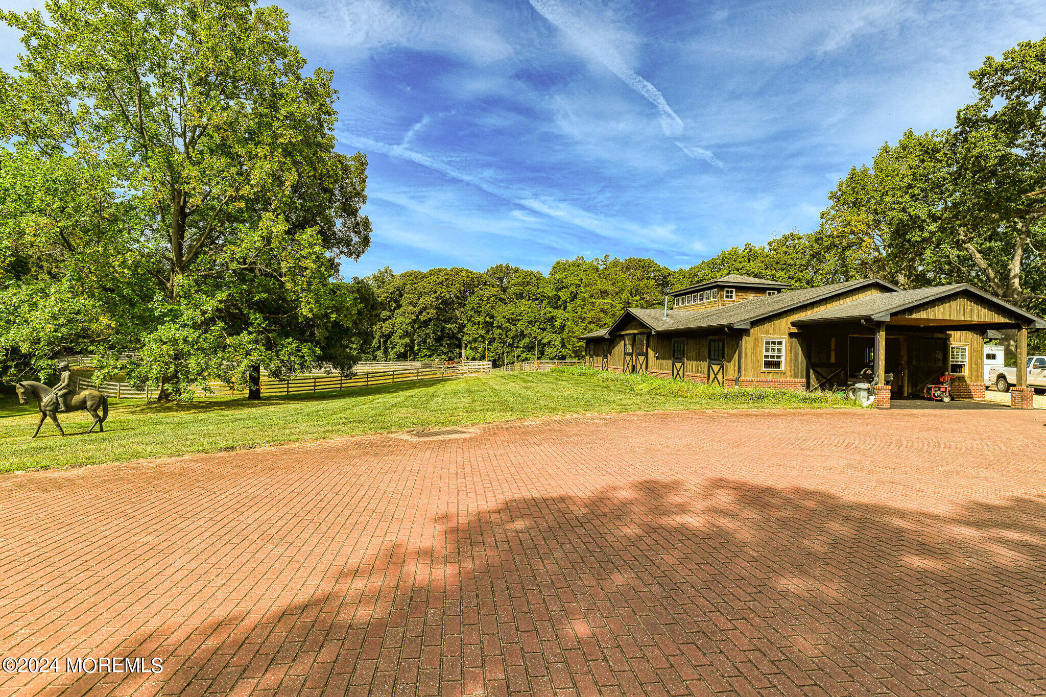 799 Navesink River Road Rumson, NJ 07760 - Photo 14 of 59 a front view of a house with a yard and trees