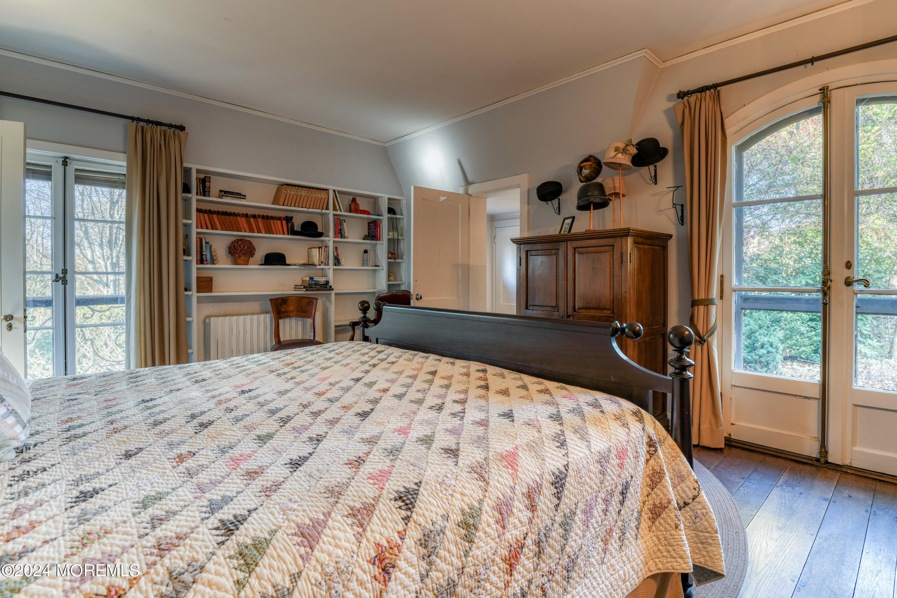 799 Navesink River Road Rumson, NJ 07760 - Photo 27 of 59 a bedroom with a large bed and a large window