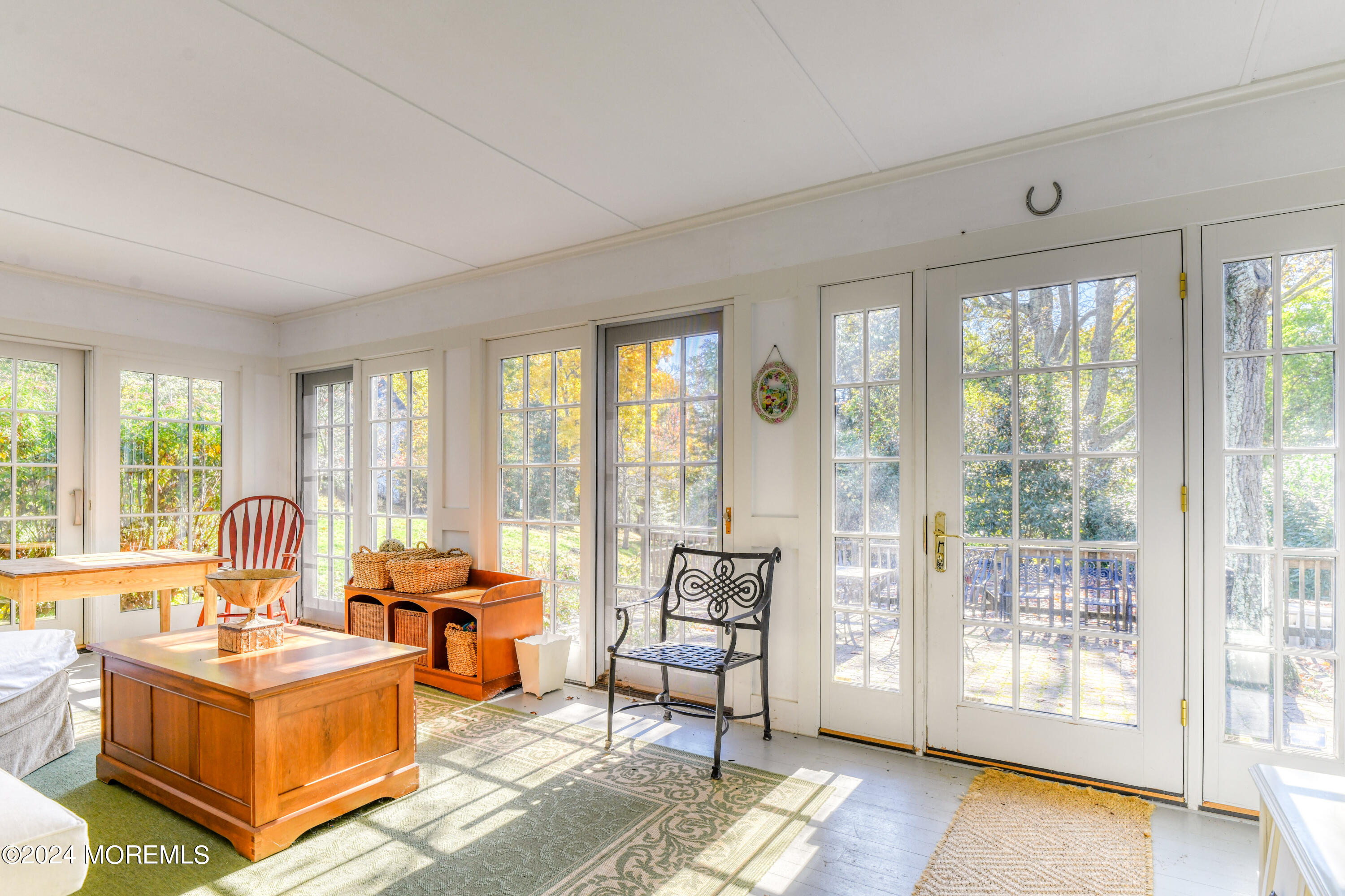 799 Navesink River Road Rumson, NJ 07760 - Photo 31 of 59 a living room with furniture and a floor to ceiling window