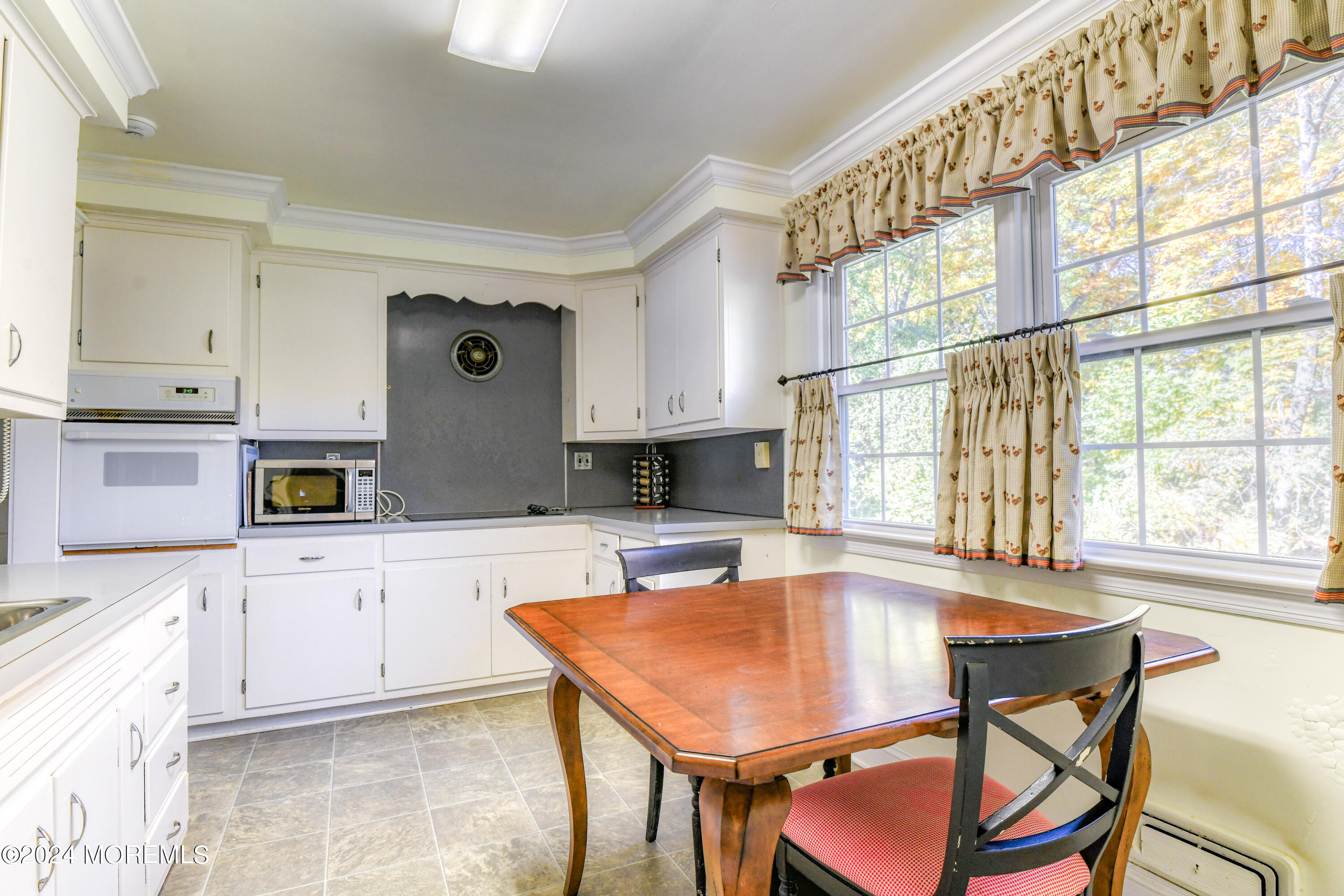 799 Navesink River Road Rumson, NJ 07760 - Photo 33 of 59 a kitchen with stainless steel appliances granite countertop a stove a sink and a refrigerator
