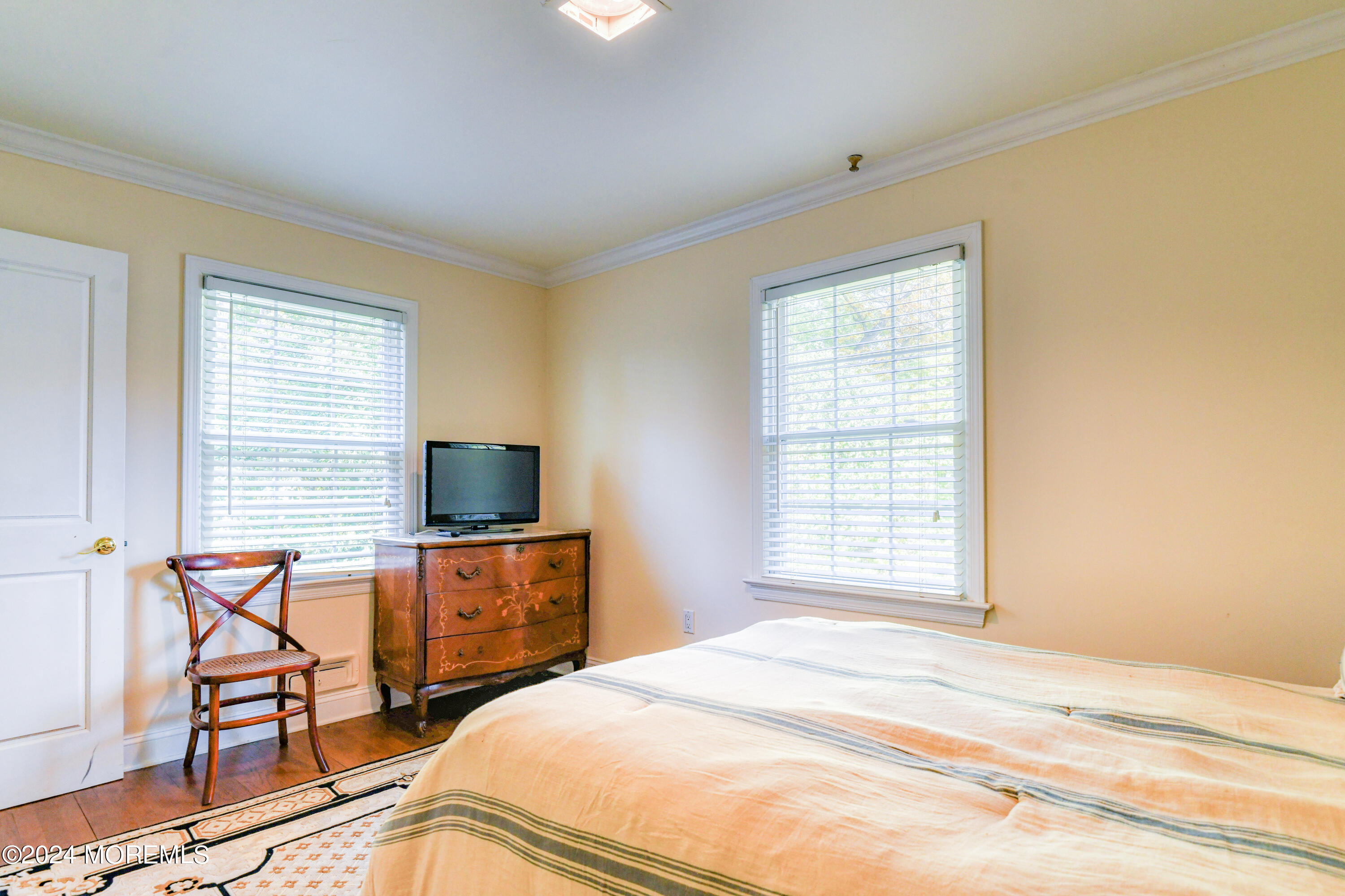 799 Navesink River Road Rumson, NJ 07760 - Photo 36 of 59 a bedroom with a bed and a flat screen tv