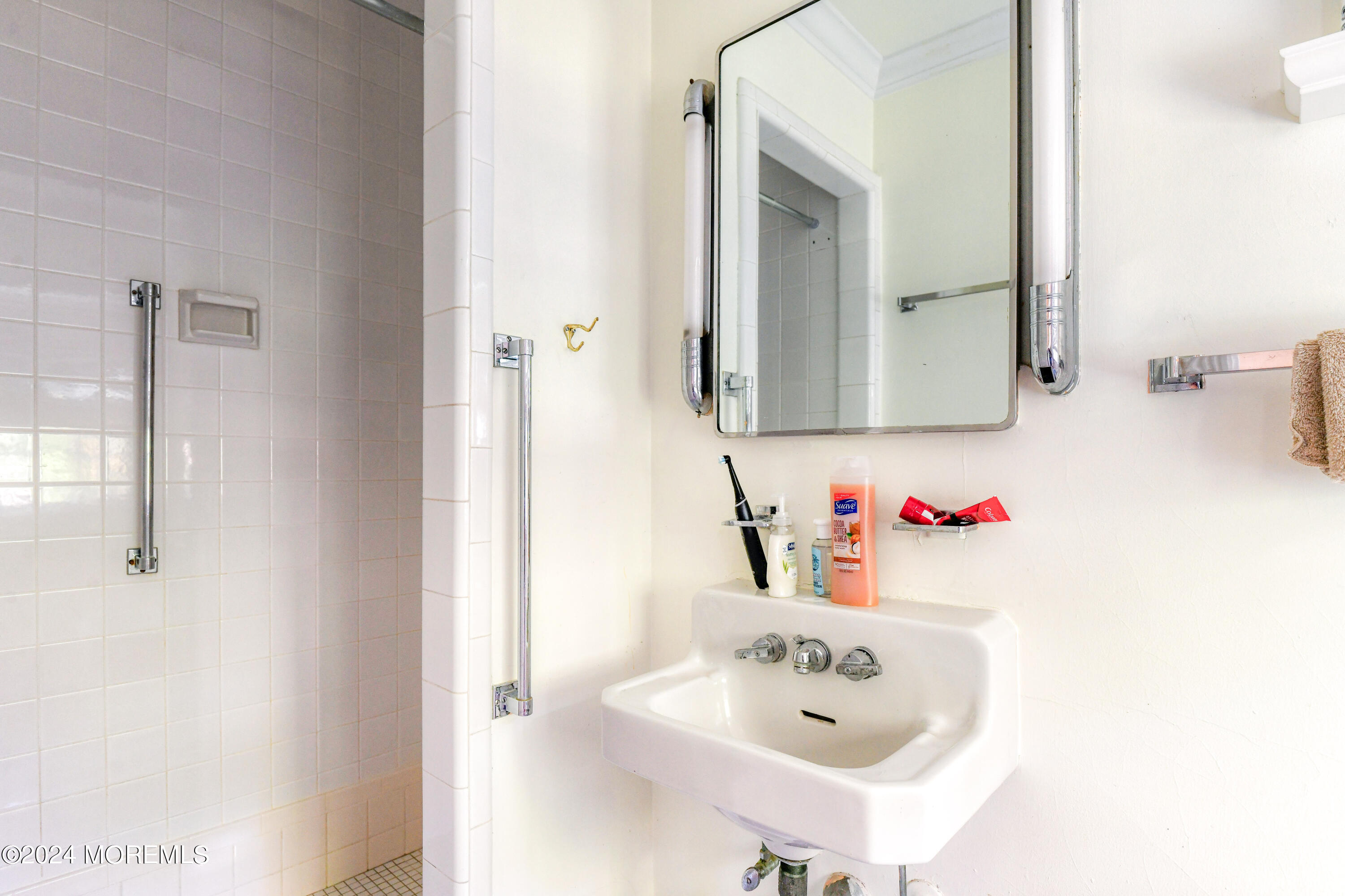799 Navesink River Road Rumson, NJ 07760 - Photo 37 of 59 a bathroom with a sink and a mirror