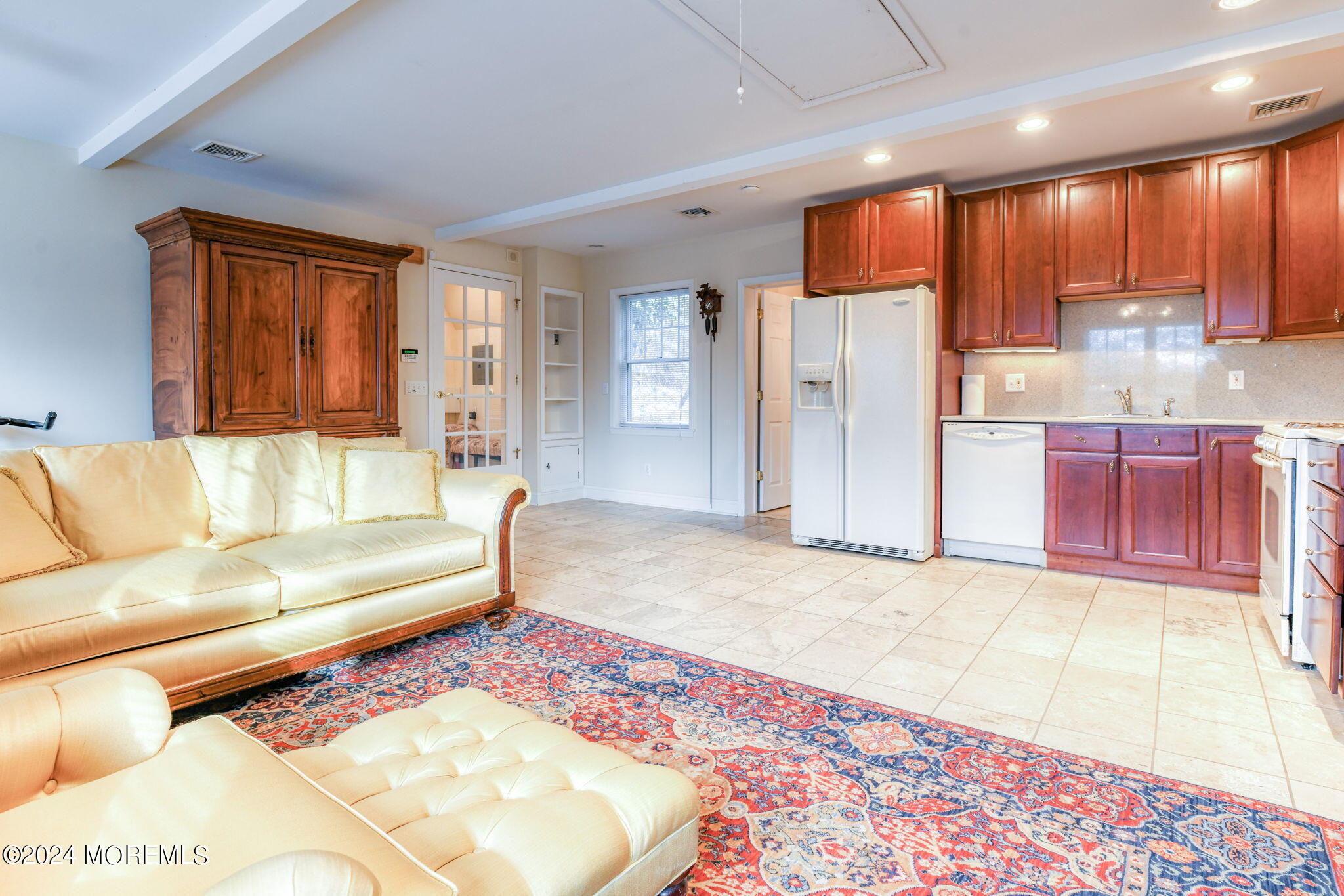 799 Navesink River Road Rumson, NJ 07760 - Photo 39 of 59 a living room with large couches and kitchen view with wooden floor