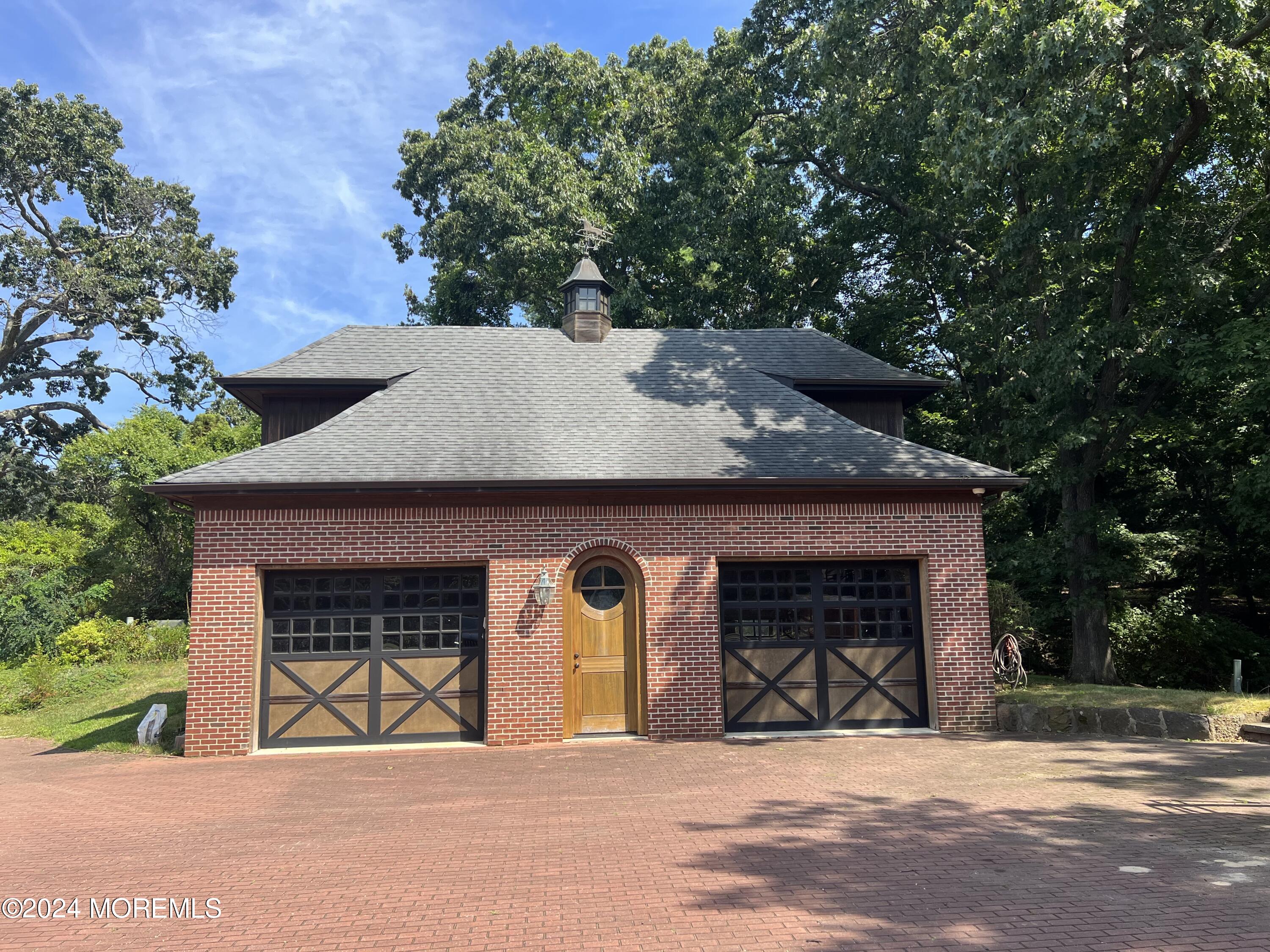 799 Navesink River Road Rumson, NJ 07760 - Photo 41 of 59 a front view of a house with garden