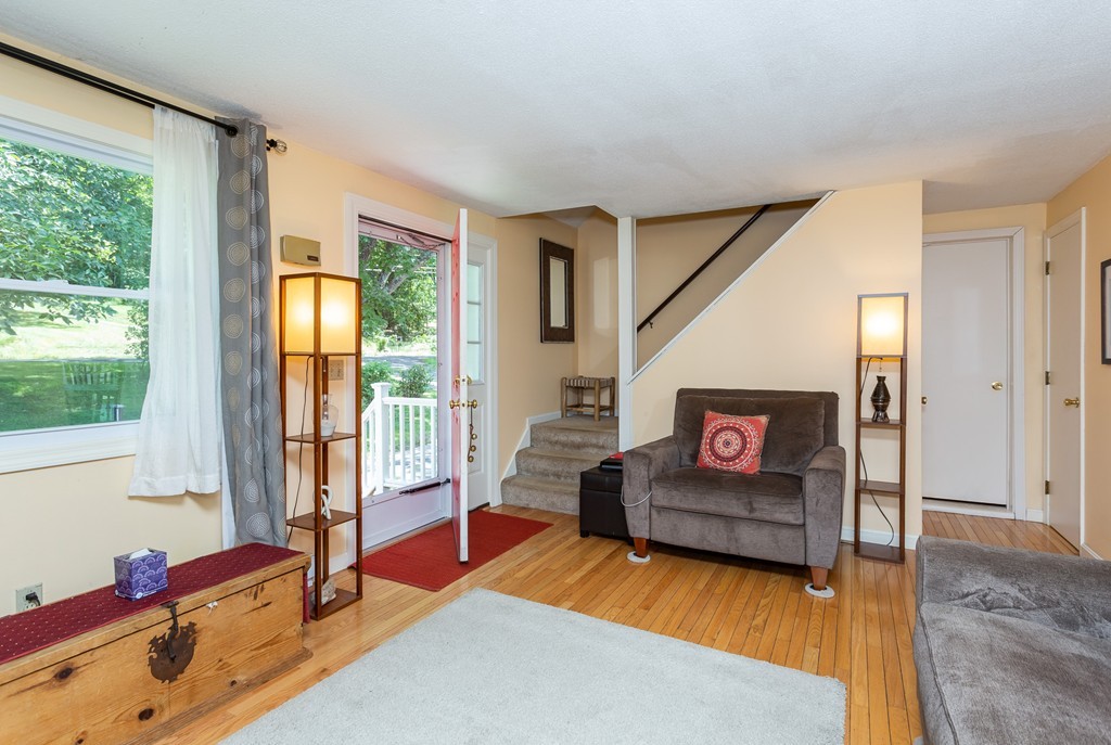 24 North Farms Road Williamsburg, MA 01039 - Photo 11 of 40 a living room with furniture and a flat screen tv