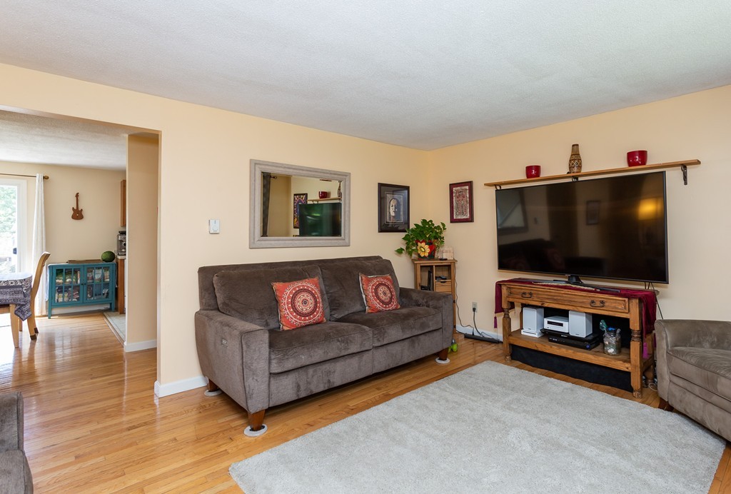 24 North Farms Road Williamsburg, MA 01039 - Photo 14 of 40 a living room with furniture and a flat screen tv