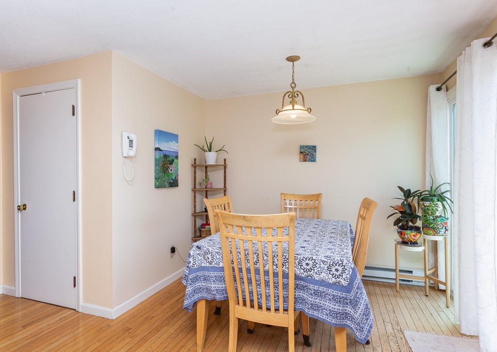 24 North Farms Road Williamsburg, MA 01039 - Photo 17 of 40 a view of a dining room with furniture and wooden floor