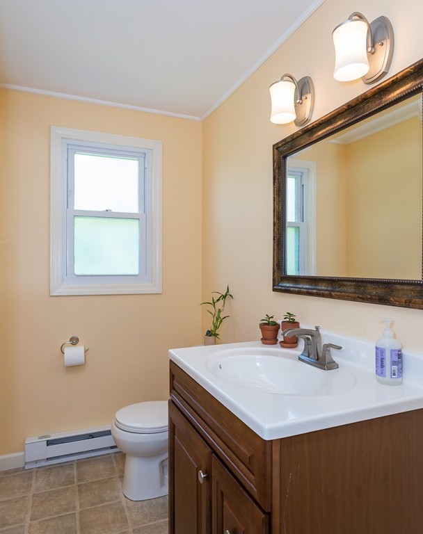 24 North Farms Road Williamsburg, MA 01039 - Photo 19 of 40 a bathroom with a sink vanity mirror and toilet