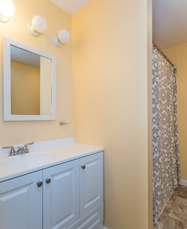 24 North Farms Road Williamsburg, MA 01039 - Photo 20 of 40 a bathroom with a sink and a mirror