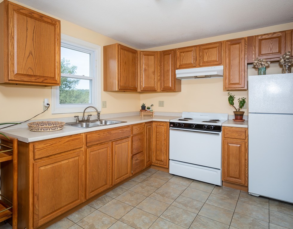 24 North Farms Road Williamsburg, MA 01039 - Photo 30 of 40 a kitchen with a sink cabinets and appliances