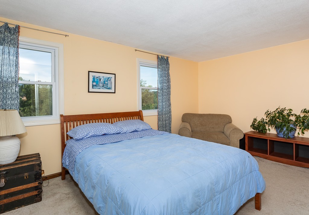 24 North Farms Road Williamsburg, MA 01039 - Photo 36 of 40 a bedroom with a large bed and a window