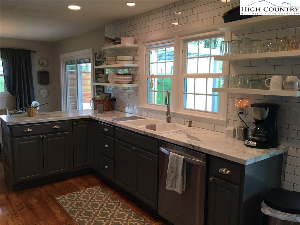 172 Deer Street Boone, NC 28607 - Photo 2 of 7 a kitchen with a sink stove and cabinets