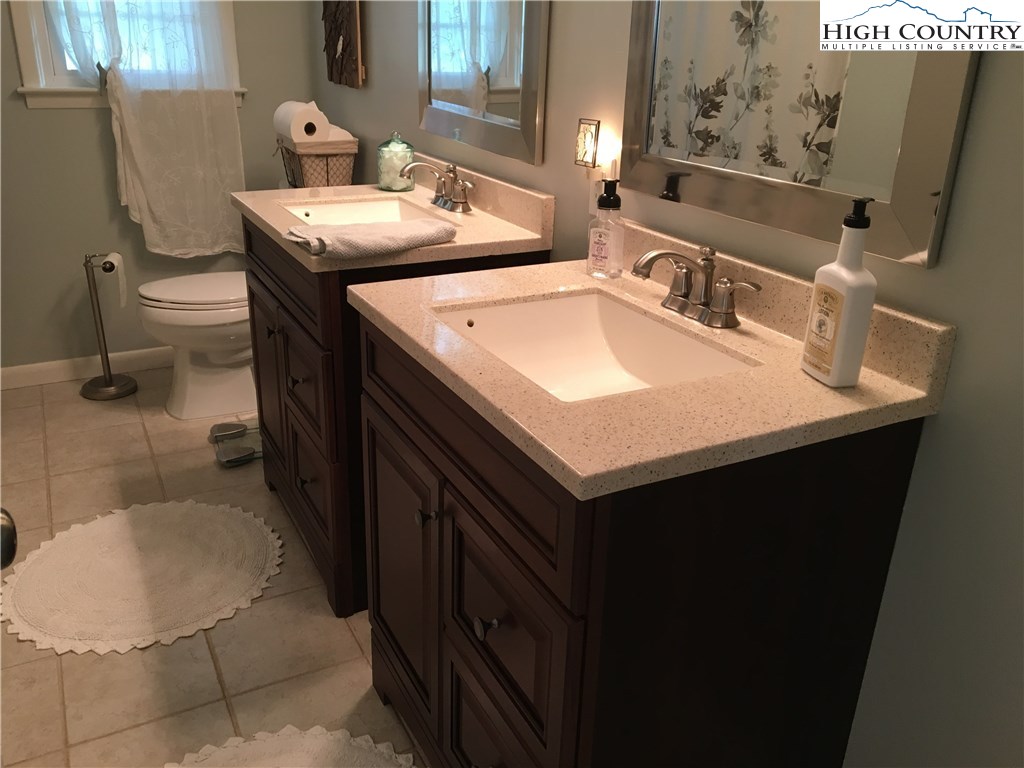 172 Deer Street Boone, NC 28607 - Photo 7 of 7 a bathroom with a sink toilet and mirror
