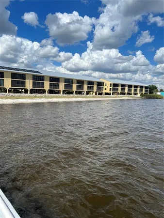a aerial view of a house next to a lake view
