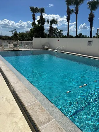 a view of swimming pool with a yard