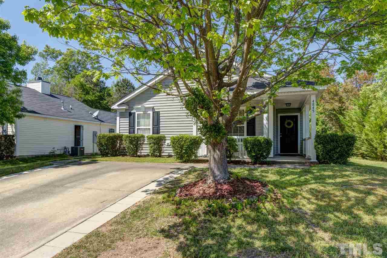 4845 Silverdene Street Raleigh, NC 27616 - Photo 1 of 24 a front view of a house with a yard and potted plants