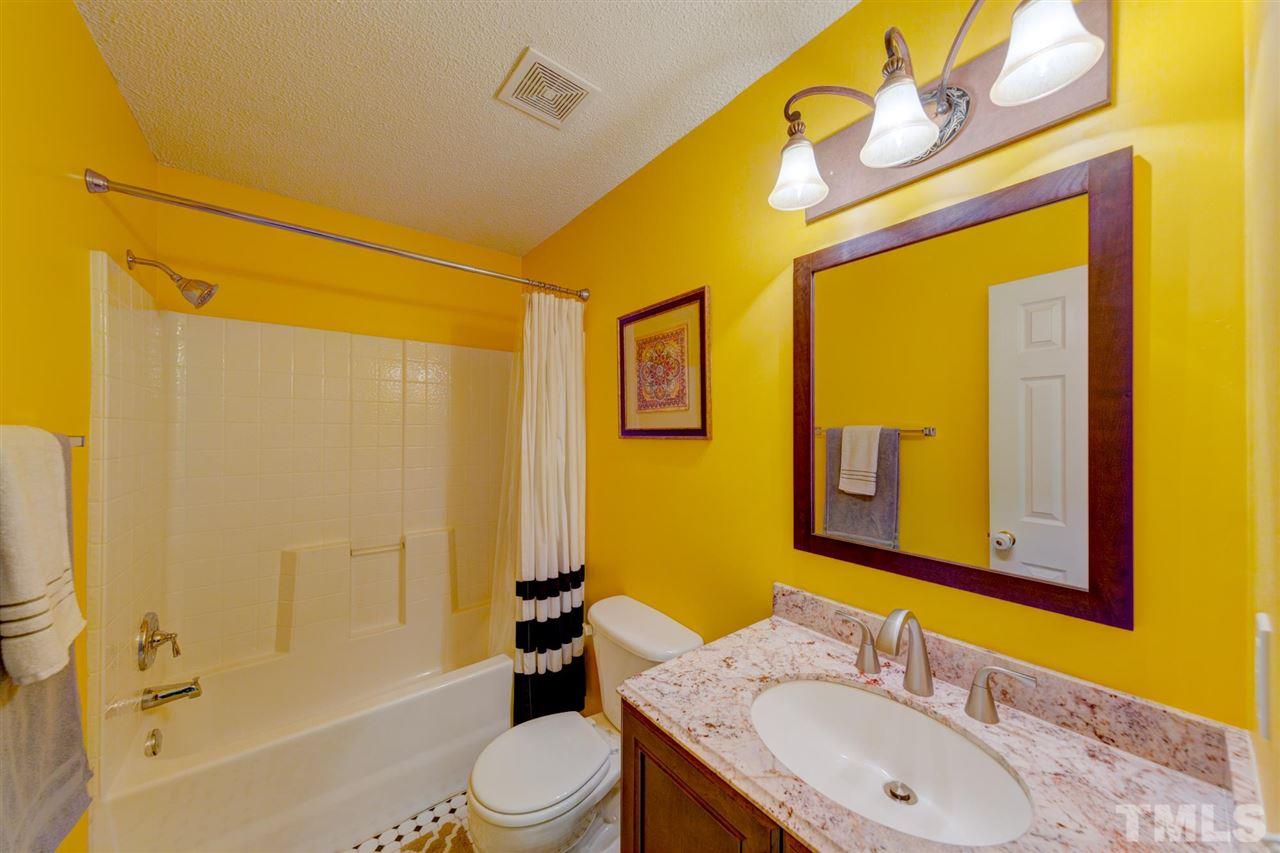 4845 Silverdene Street Raleigh, NC 27616 - Photo 12 of 24 a bathroom with a granite countertop sink toilet and shower