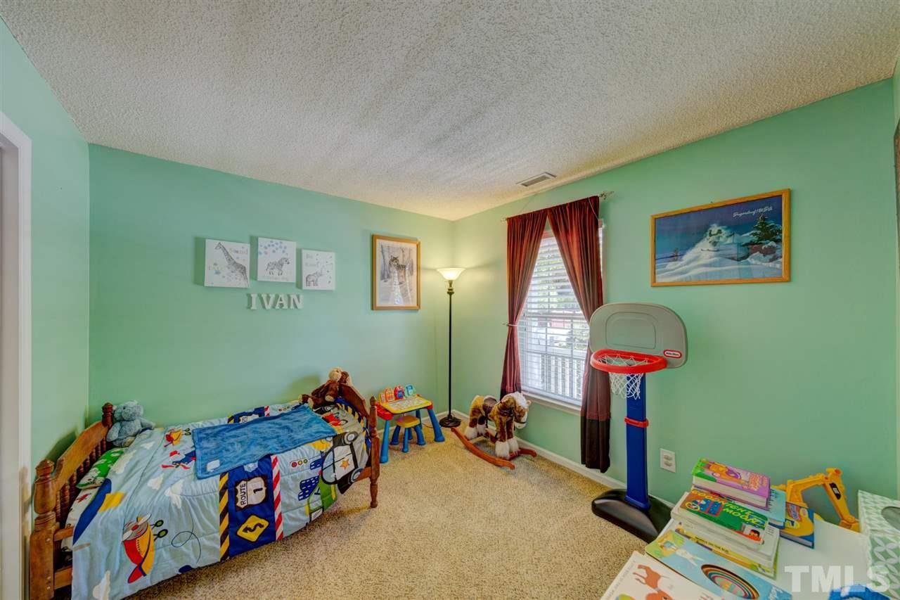 4845 Silverdene Street Raleigh, NC 27616 - Photo 14 of 24 a room with toys and a wooden floor